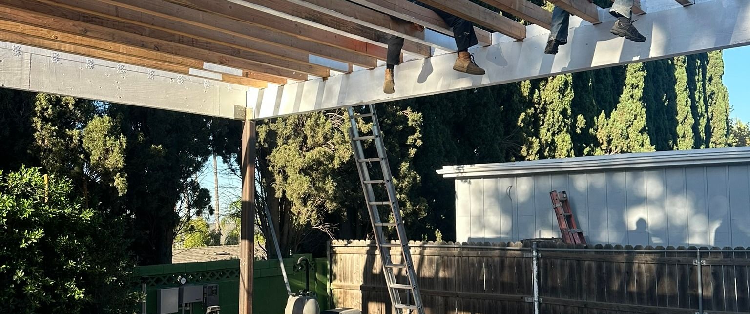 Arnwood — pergola rafters seen from below, under construction