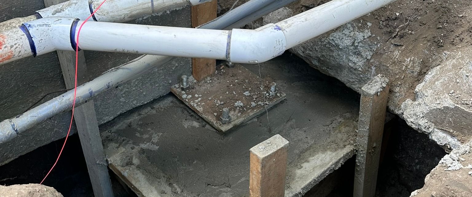 Arnwood — rebar and plumbing set in the formwork, under construction