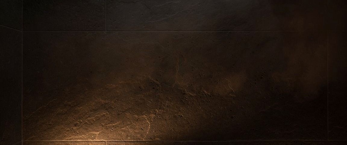 Steam drifting across a stone-lined surface